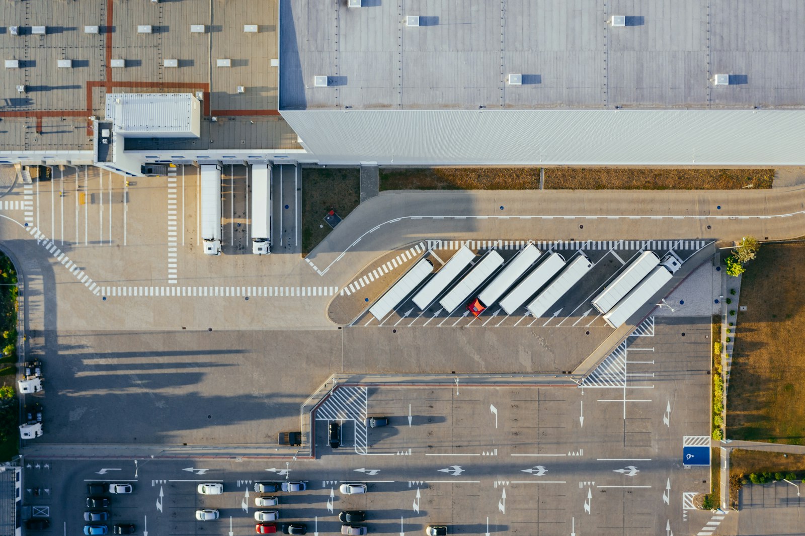Aerial view of a distribution yard with trailers at dock doors